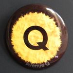 A furry yellow circle containing a large Q